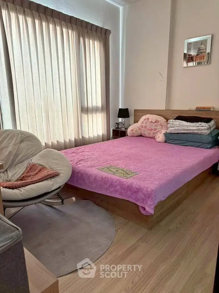 Cozy bedroom with natural light and modern furnishings