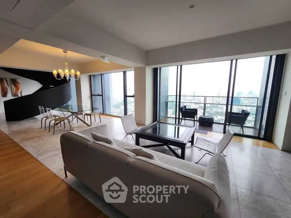 Luxurious living room with panoramic city view and elegant spiral staircase.
