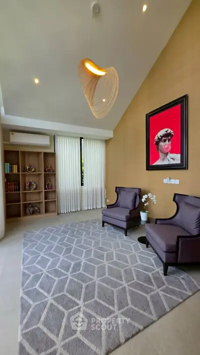 Elegant living room with modern decor, high ceiling, and stylish furniture in a luxurious home.