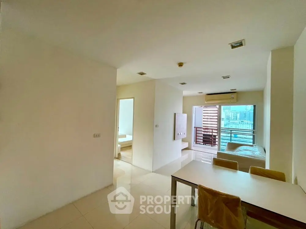 Spacious modern apartment with open layout and city view, featuring sleek interiors and abundant natural light.