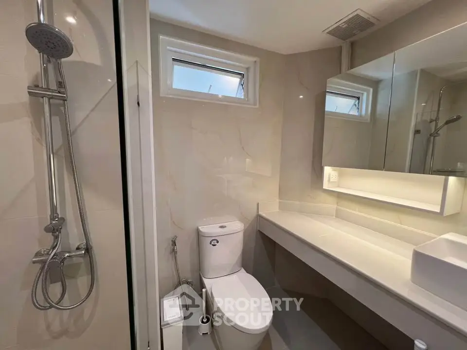 Modern bathroom with sleek fixtures and elegant lighting