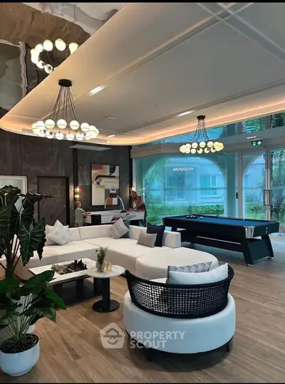 Luxurious modern living room with elegant lighting and stylish furniture, perfect for entertaining.