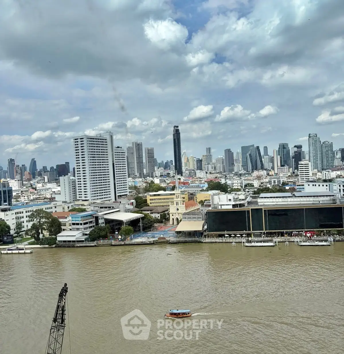 Stunning cityscape view with river and modern skyline, perfect for urban living enthusiasts.