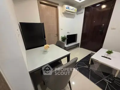 Modern compact living room with sleek furniture and air conditioning