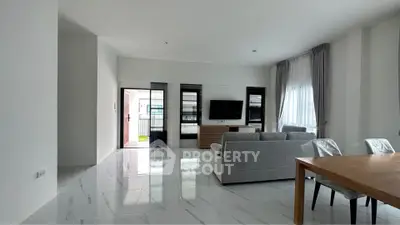 Spacious modern living room with sleek design and natural light