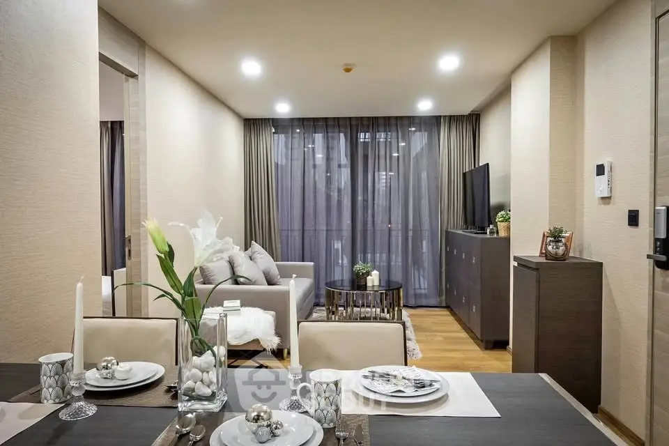 Modern living room with elegant decor and open layout, featuring a cozy seating area and dining space.