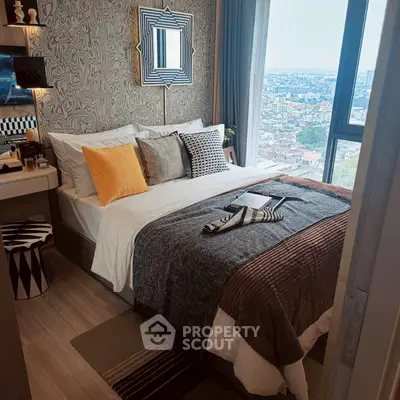 Chic bedroom with city view, stylish decor, and cozy ambiance