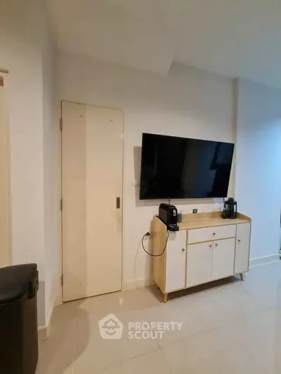 Modern living room with sleek TV setup and stylish cabinet