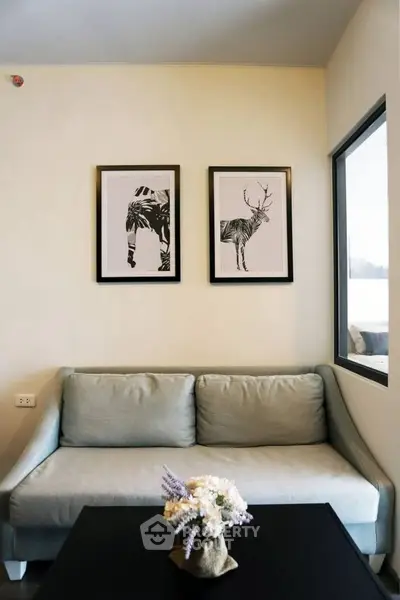 Stylish living room with modern sofa and artistic wall decor