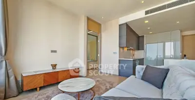 Modern living room with open kitchen and stylish furniture