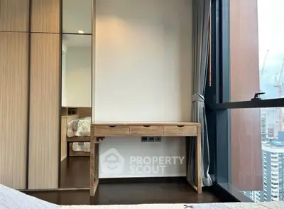 Modern bedroom with wooden furniture and city view from large window