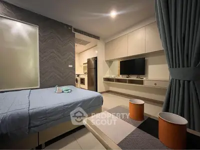 Modern studio apartment with stylish decor and in-unit appliances