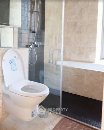 Modern bathroom with glass shower and sleek fixtures