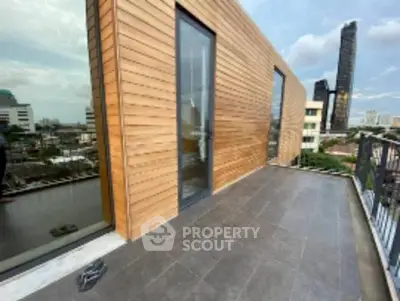 Modern balcony with city view and sleek wooden paneling, perfect for urban living.