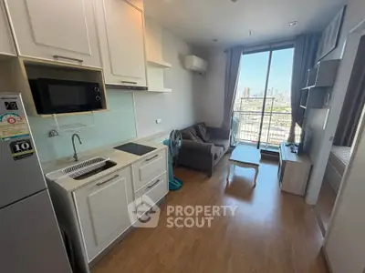 Modern studio apartment with open kitchen and city view balcony