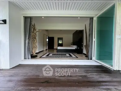 Luxurious bedroom with open balcony, modern decor, and serene ambiance