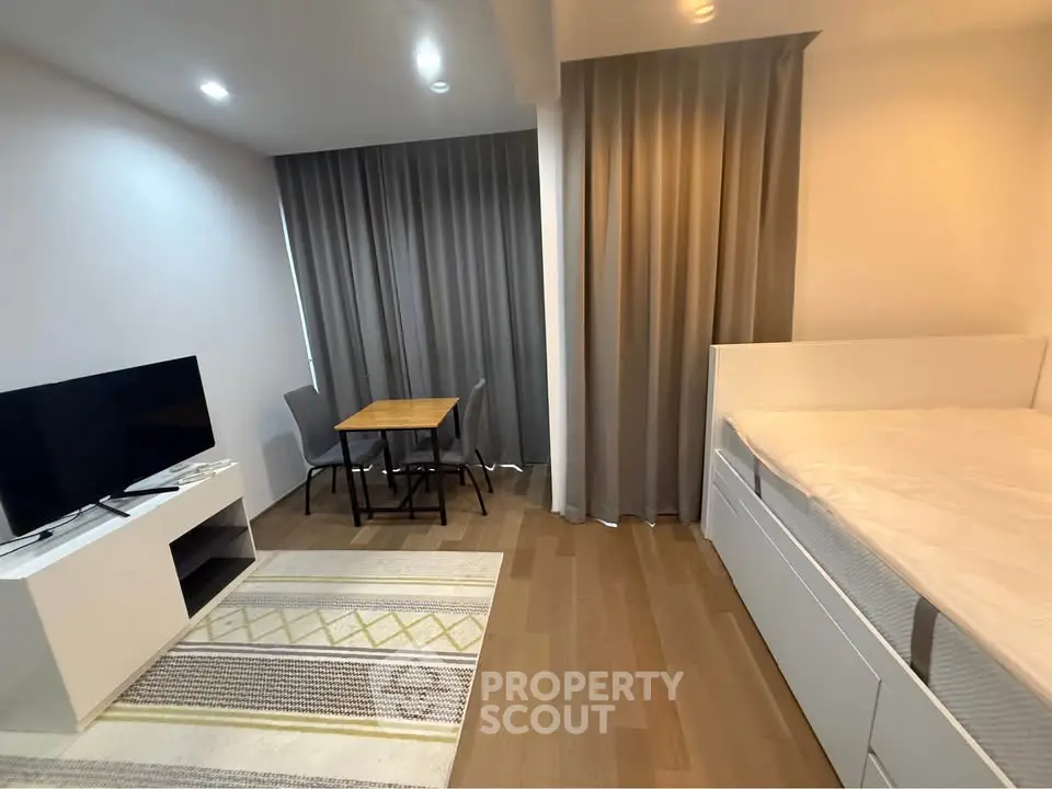 Modern studio apartment with cozy living area and stylish decor