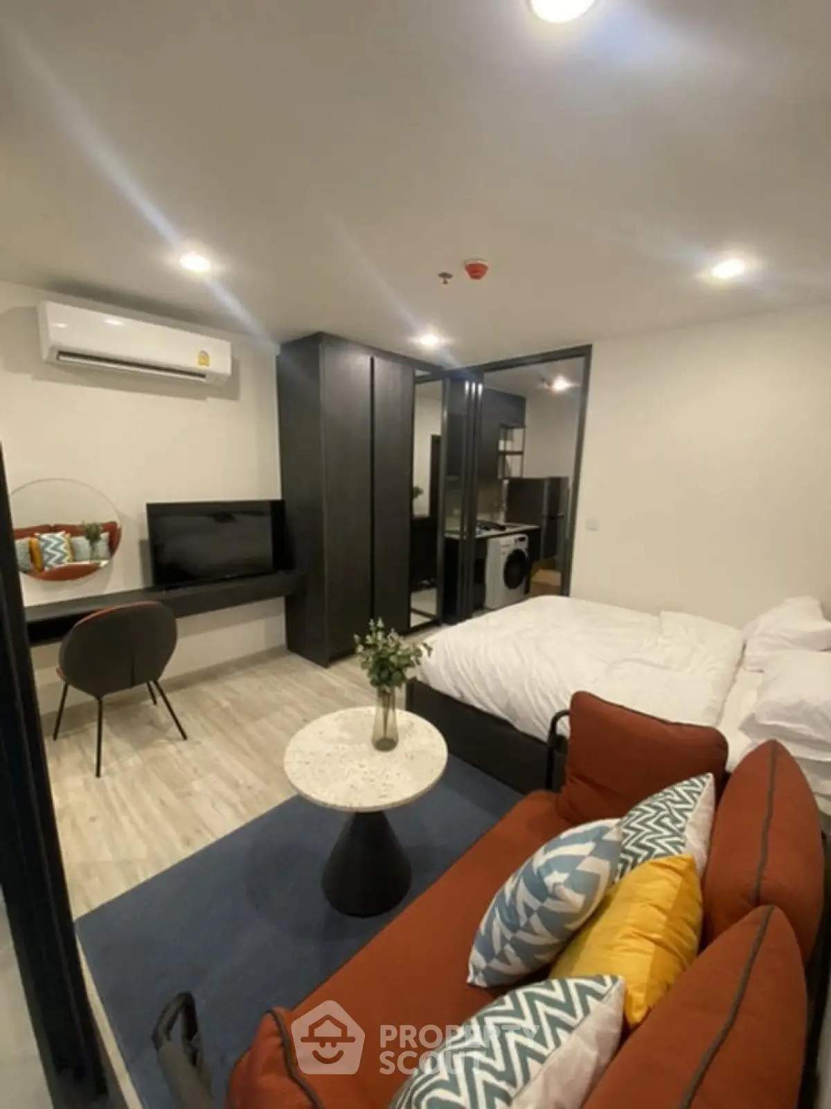 Modern studio apartment with cozy living area and stylish decor