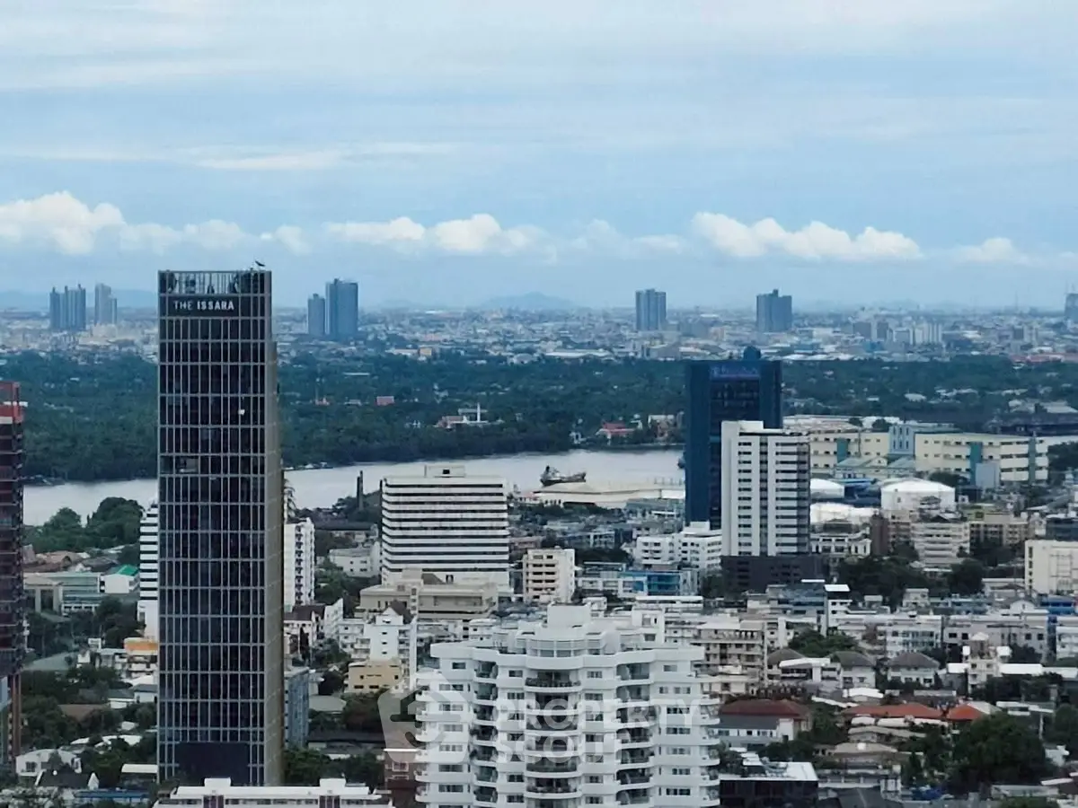 Stunning cityscape view with modern high-rise buildings and lush greenery.