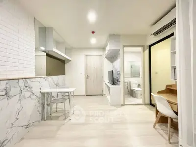 Modern apartment interior with open layout, featuring stylish furniture and elegant marble accents.