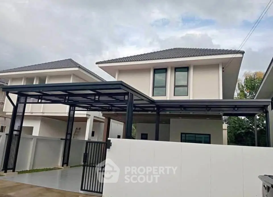 Modern two-story house with sleek carport and contemporary design.