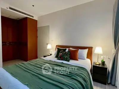 Cozy bedroom with elegant decor and ambient lighting, featuring a comfortable bed and stylish furnishings.