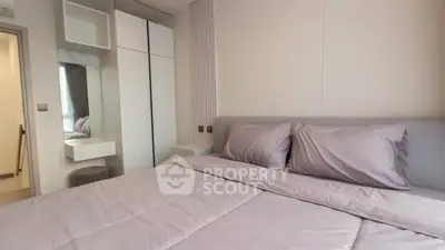 Modern bedroom with sleek design and ample storage space