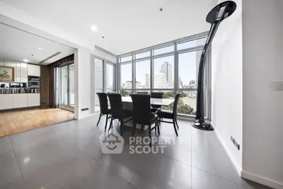 Spacious modern dining area with city view in luxury apartment