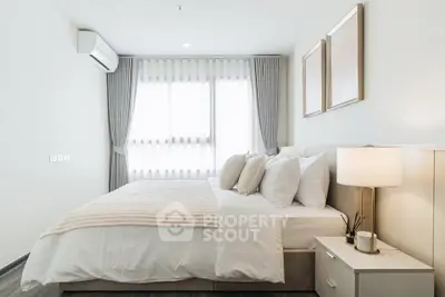 Elegant bedroom with modern decor and natural light