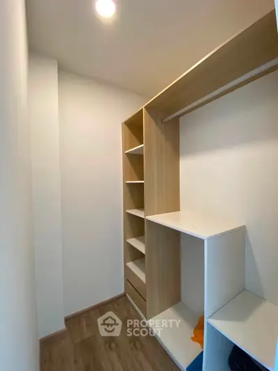 Spacious walk-in closet with modern shelving and ample storage space.
