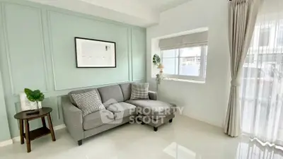 Chic and cozy living room with modern gray sofa and elegant decor