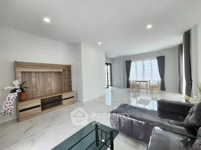 Spacious modern living room with sleek furniture and natural light