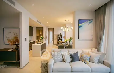 Luxurious open-plan living room with modern kitchen and elegant decor