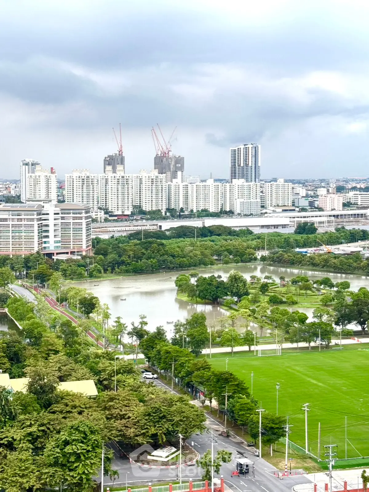 Stunning cityscape view with lush greenery and modern high-rise buildings