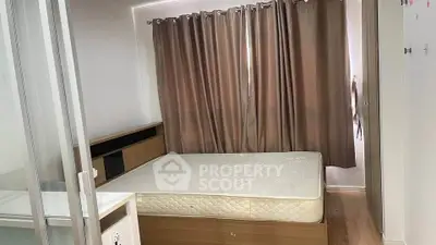 Cozy bedroom with modern furnishings and natural light