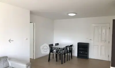 Spacious living room with modern dining set and minimalist decor