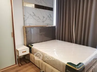 Modern bedroom with elegant decor and comfortable bed in a stylish apartment.