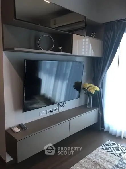 Modern living room with sleek TV setup and elegant decor
