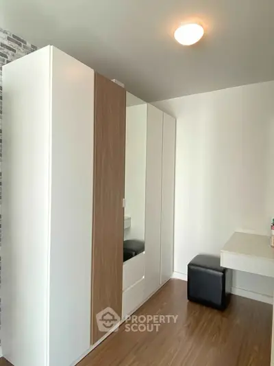 Modern bedroom with sleek wardrobe and minimalist design