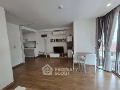 Spacious living room with wooden flooring and modern decor