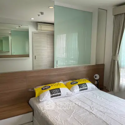 Modern bedroom with stylish decor and ample natural light