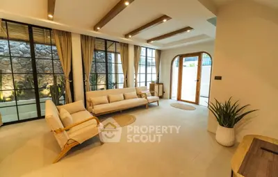 Spacious living room with modern design and large windows for natural light.