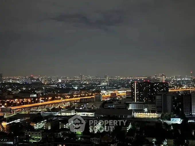 Stunning cityscape night view with illuminated skyline and highways.
