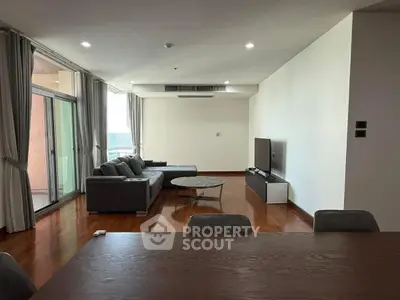 Spacious modern living room with sleek furniture and large windows