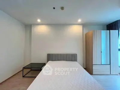 Modern minimalist bedroom with sleek furniture and natural light