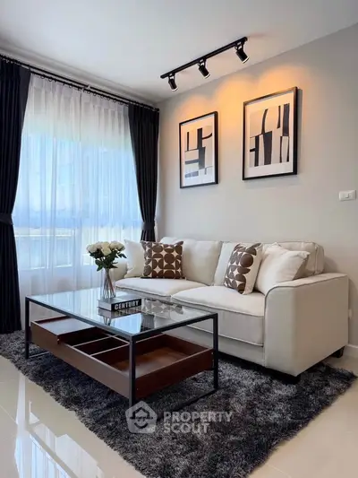 Stylish modern living room with elegant decor and cozy seating area.