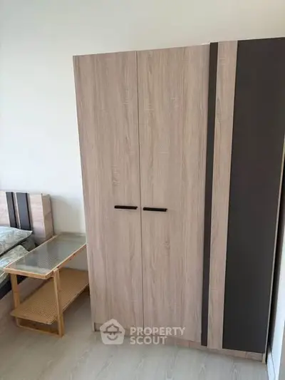 Modern bedroom with sleek wardrobe and stylish side table