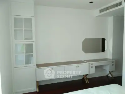 Modern bedroom with built-in storage and sleek design, perfect for urban living.