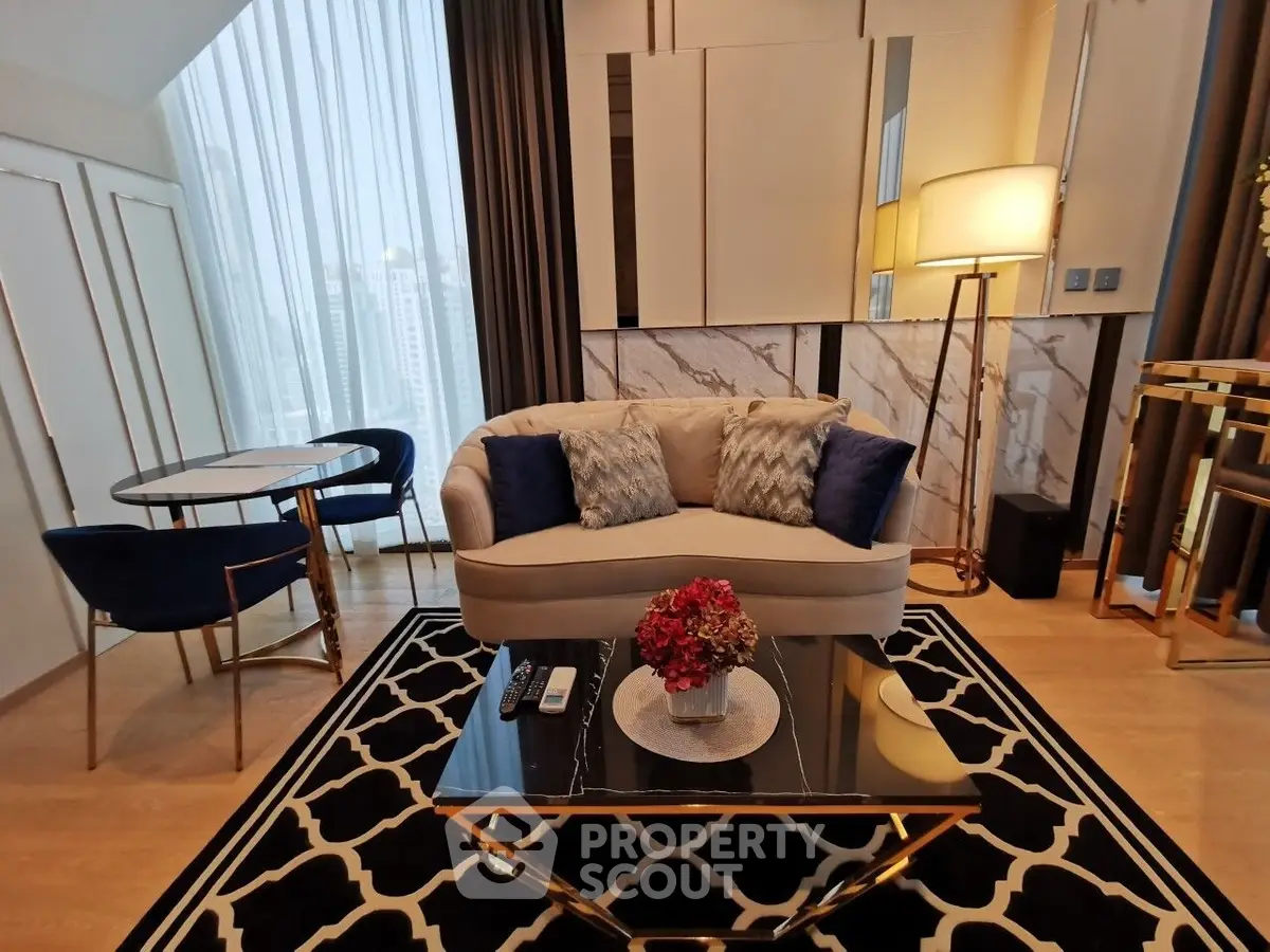 Luxurious modern living room with elegant decor and city view, featuring plush sofa and stylish coffee table.