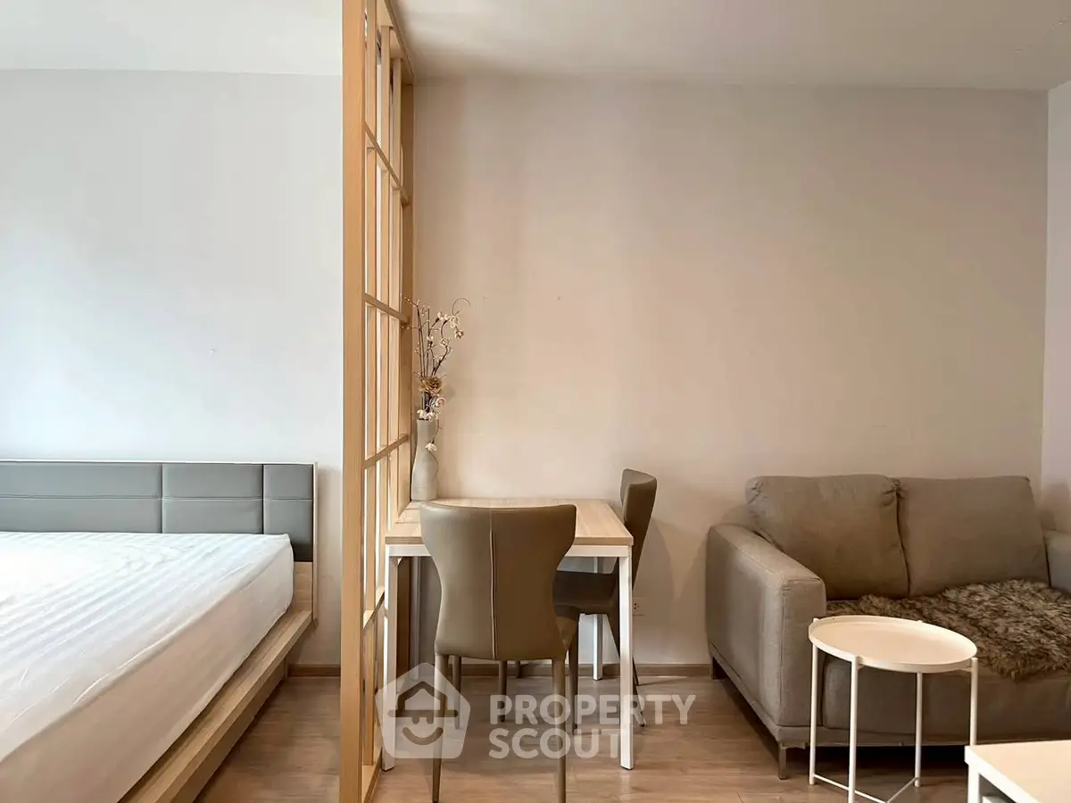 Modern studio apartment with cozy living area and stylish furniture